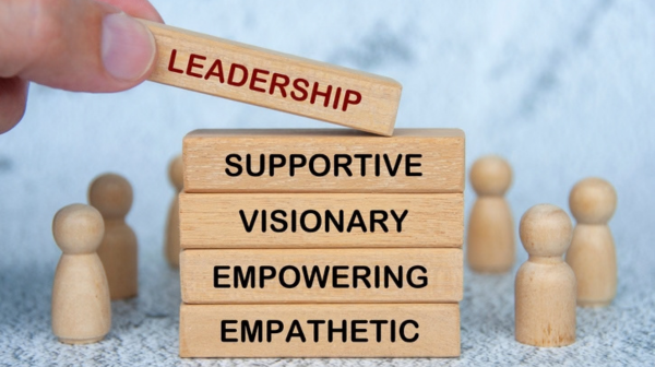 Leadership, supportive, visionary, empowering and empathetic text on wooden blocks.