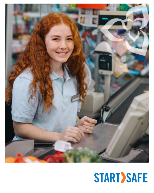 Young female worker working at the cash in a grocery store.